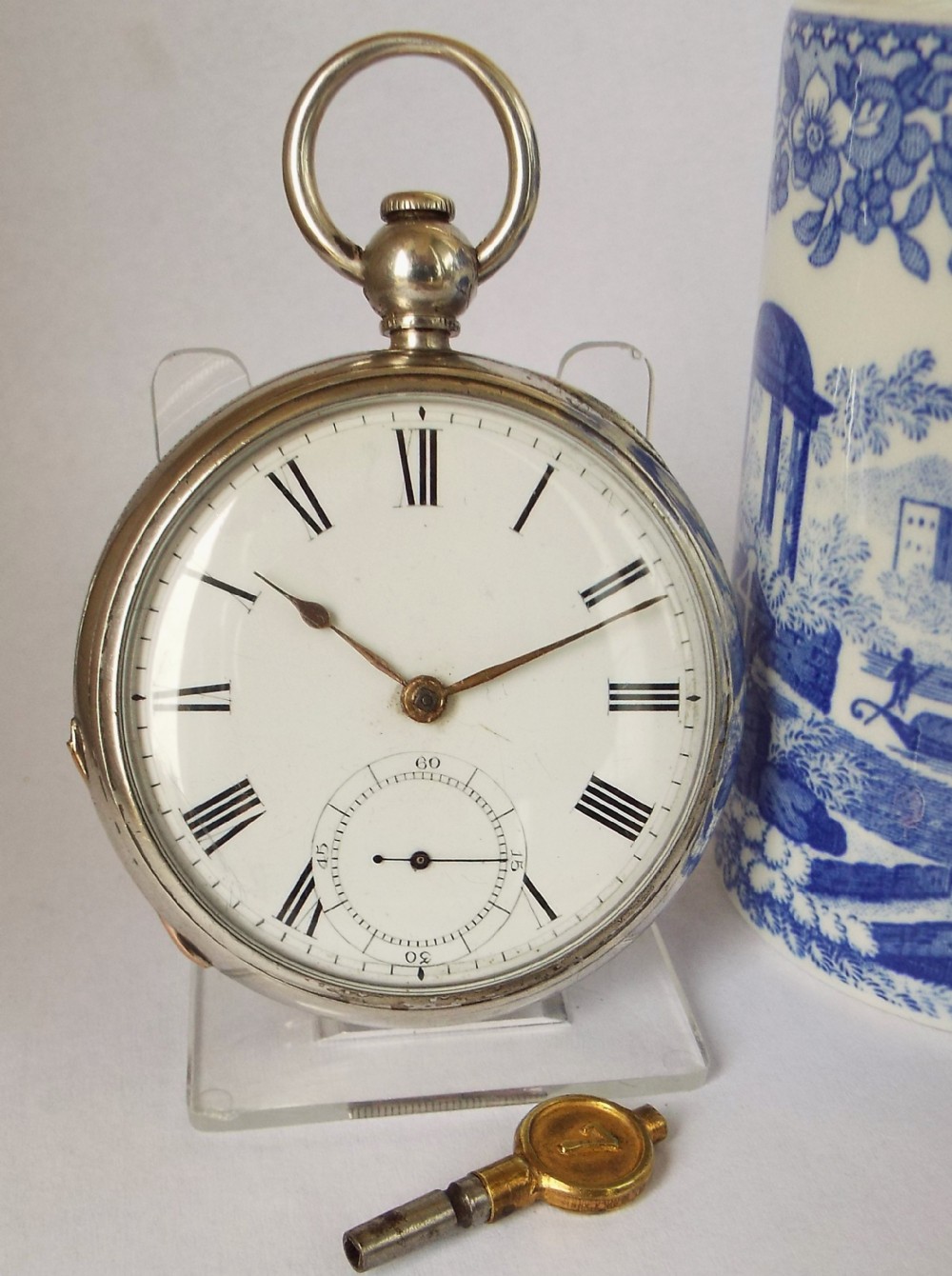 An antique 1877 silver Waltham pocket watch.