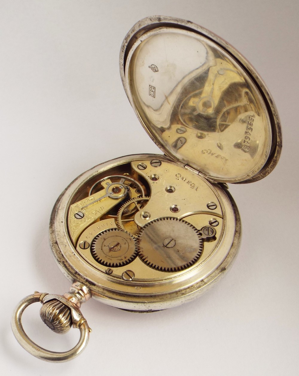 An antique Omega pocket watch. View V