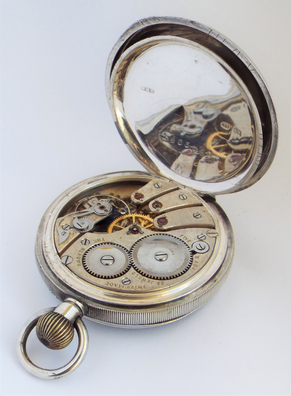 A 1920s silver Renown pocket watch, 23 jewels. View IV