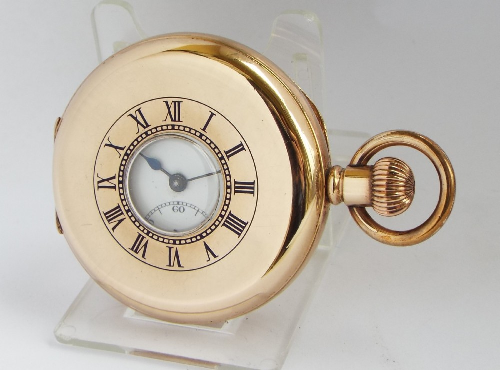 A vintage 1920s Swiss half hunter pocket watch.
