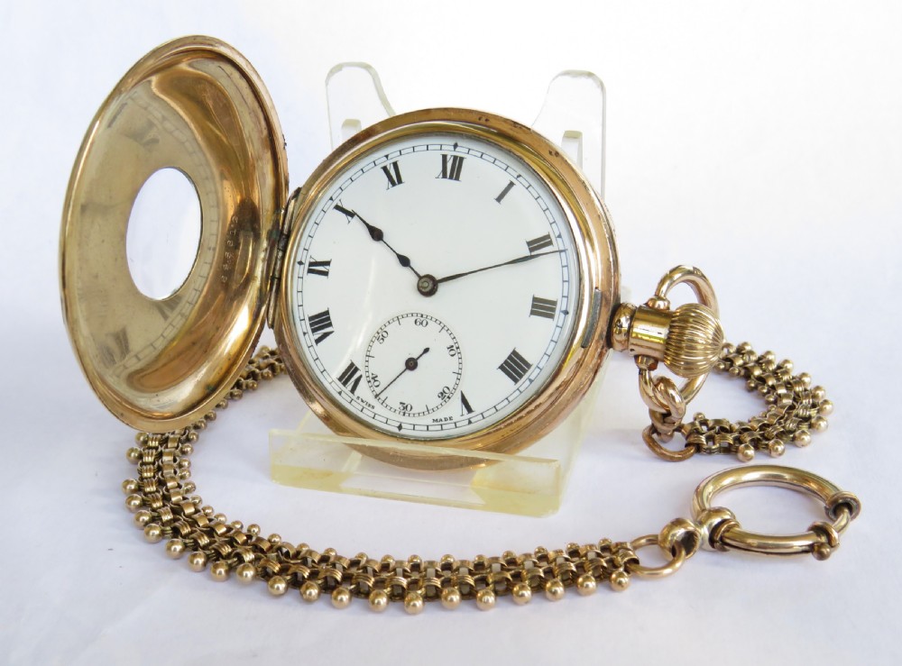 A 1920s Cyma half hunter pocket watch & chain.