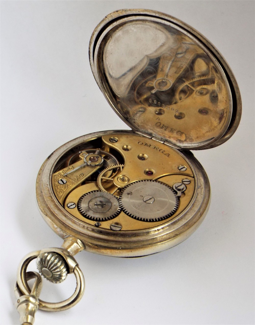 Antique Omega pocket watch and chain. View IV