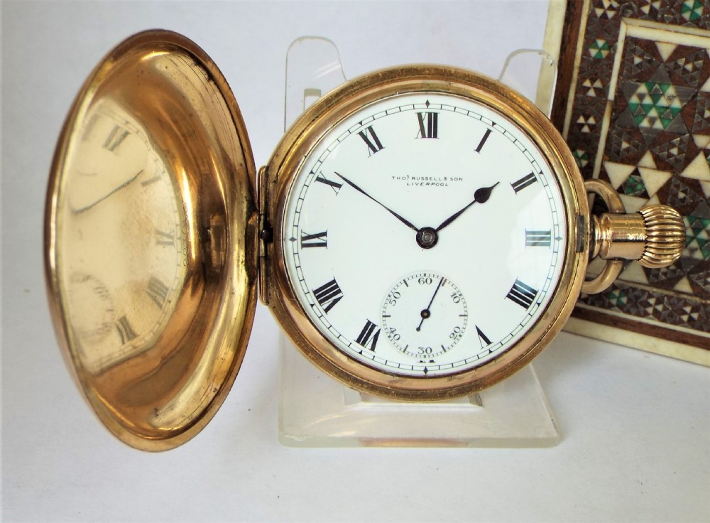 A 1920s Thomas Russell full hunter pocket watch.