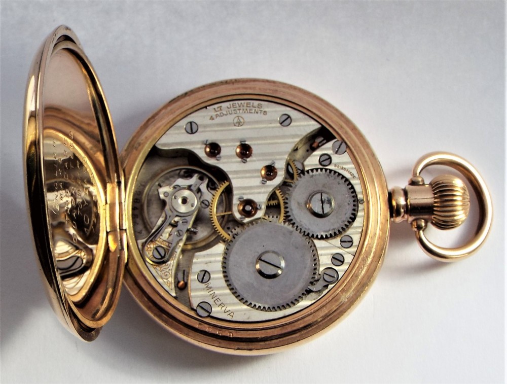 An antique Minerva half hunter pocket watch. View V