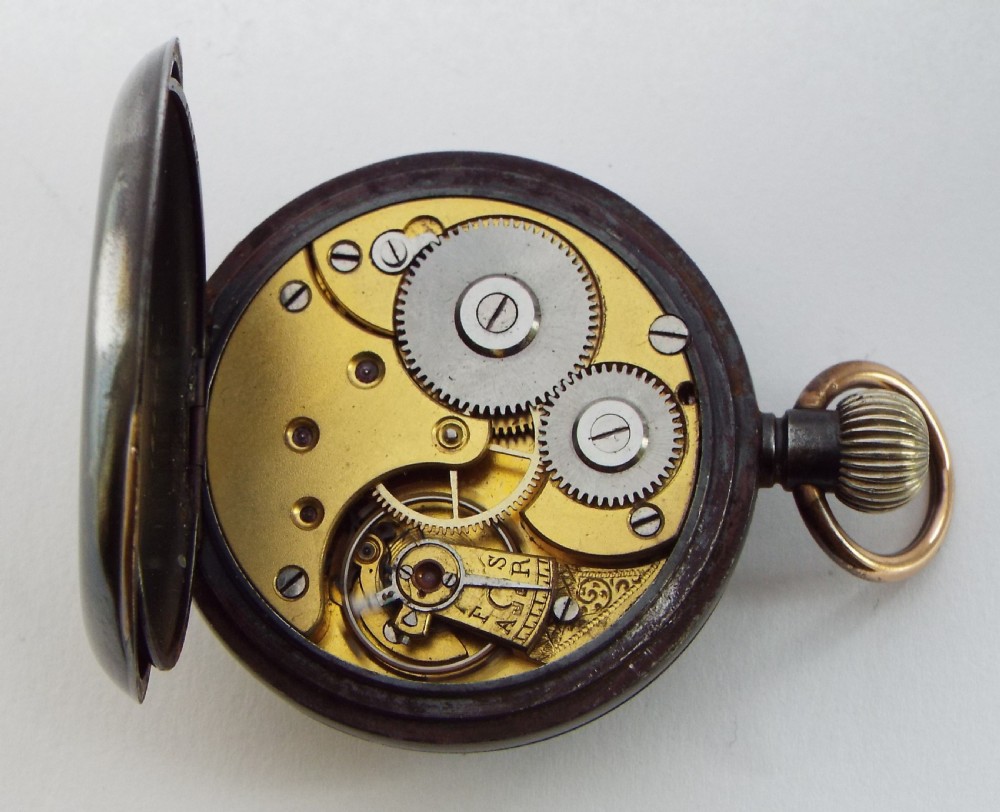An antique gun metal Omega pocket watch. View V
