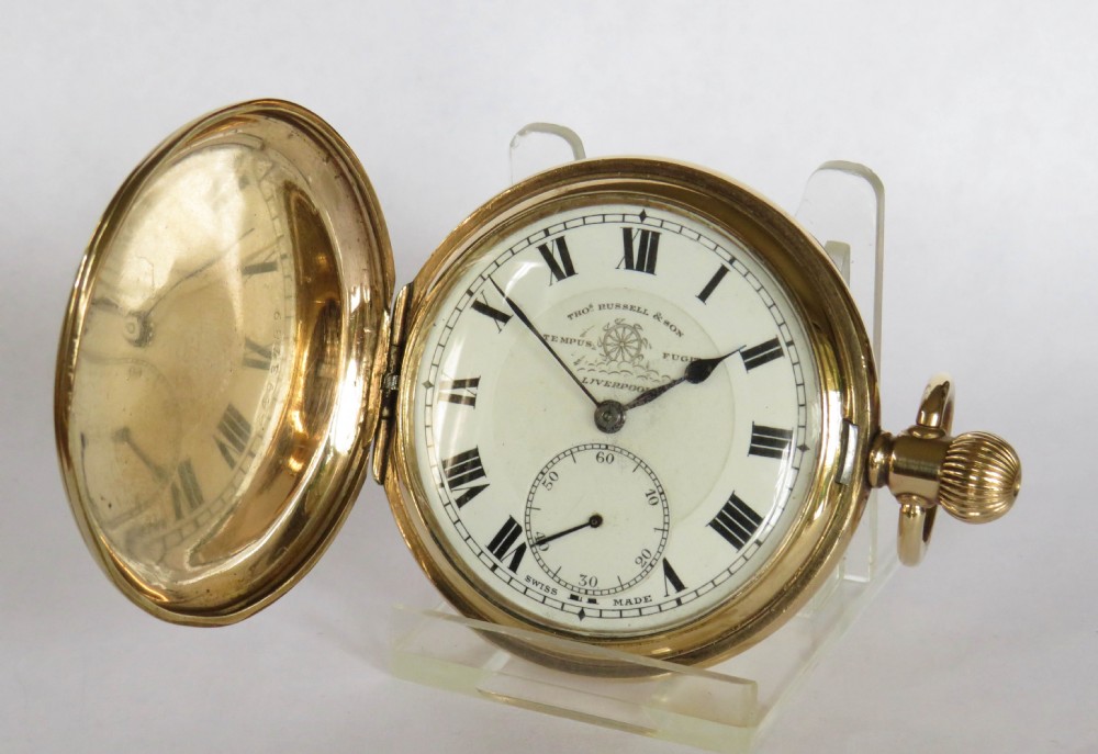A 1930s Thomas Russell full hunter pocket watch.