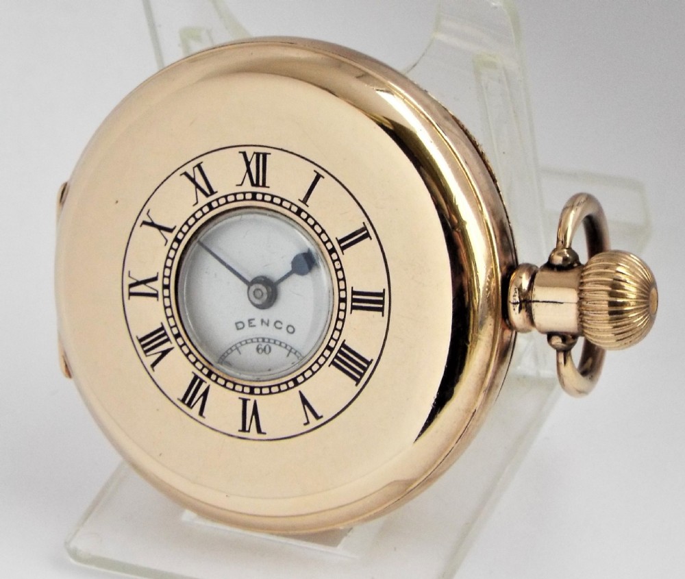 A 1930s Denco half hunter pocket watch.
