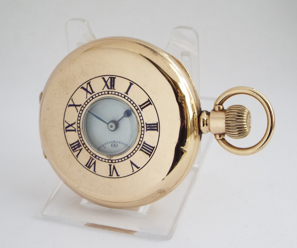 A vintage 1920s Swiss half hunter pocket watch.