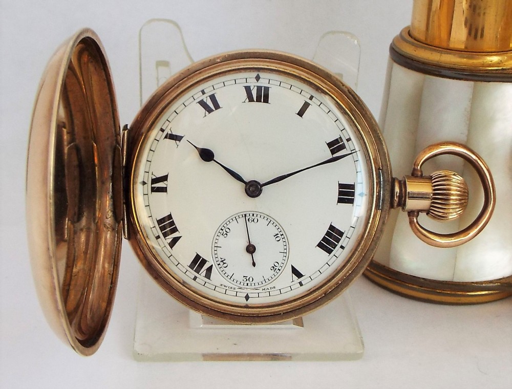 A 1920s Swiss full hunter pocket watch.