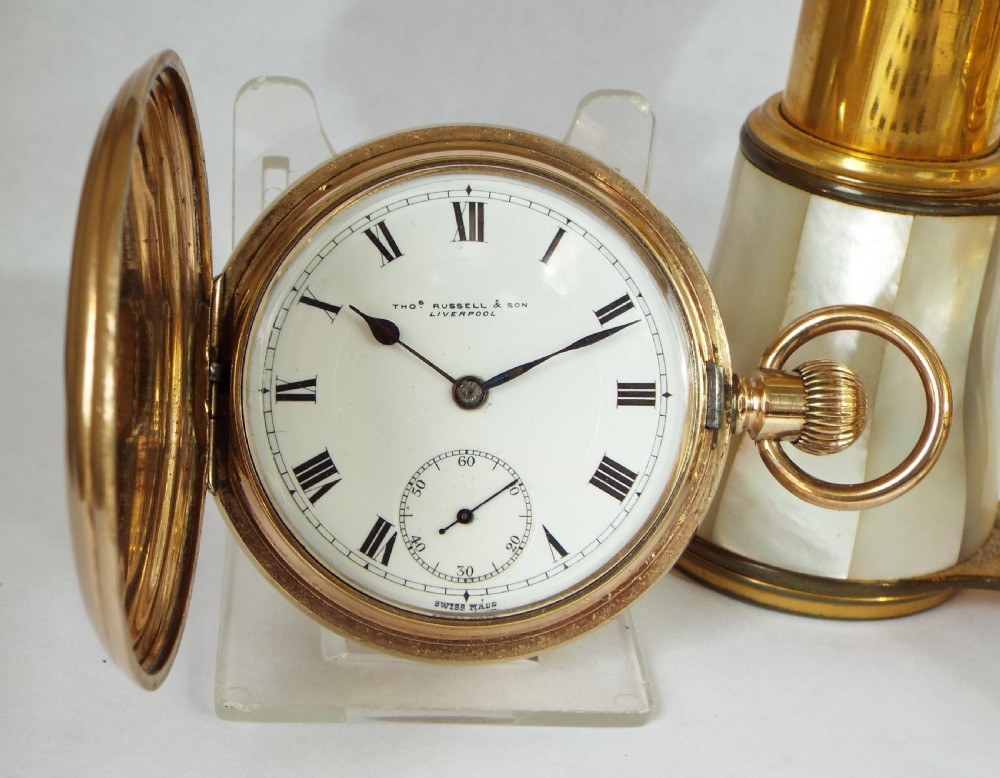 A 1920s Thomas Russell full hunter pocket watch.