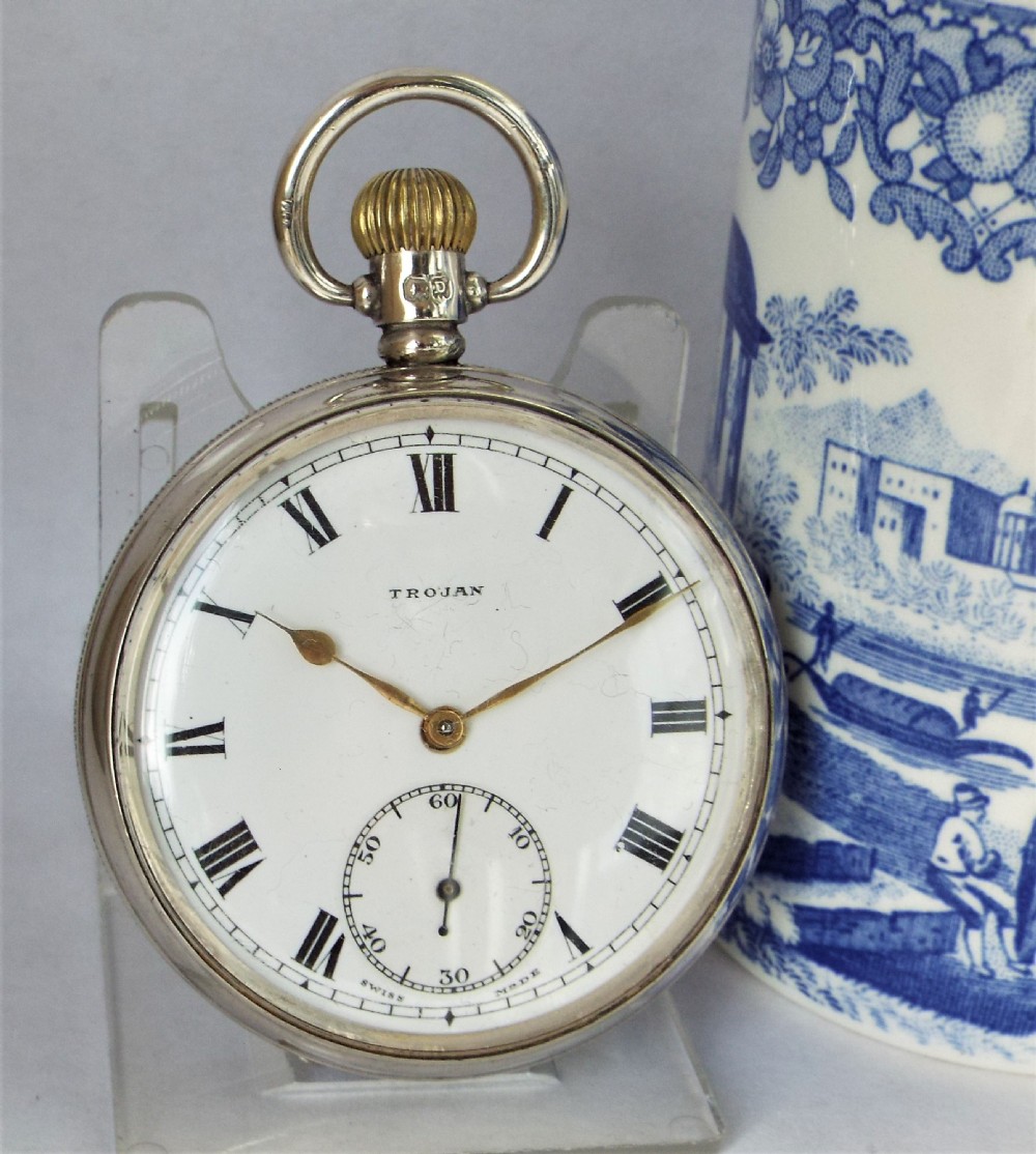 A 1920s silver Trojan pocket watch.