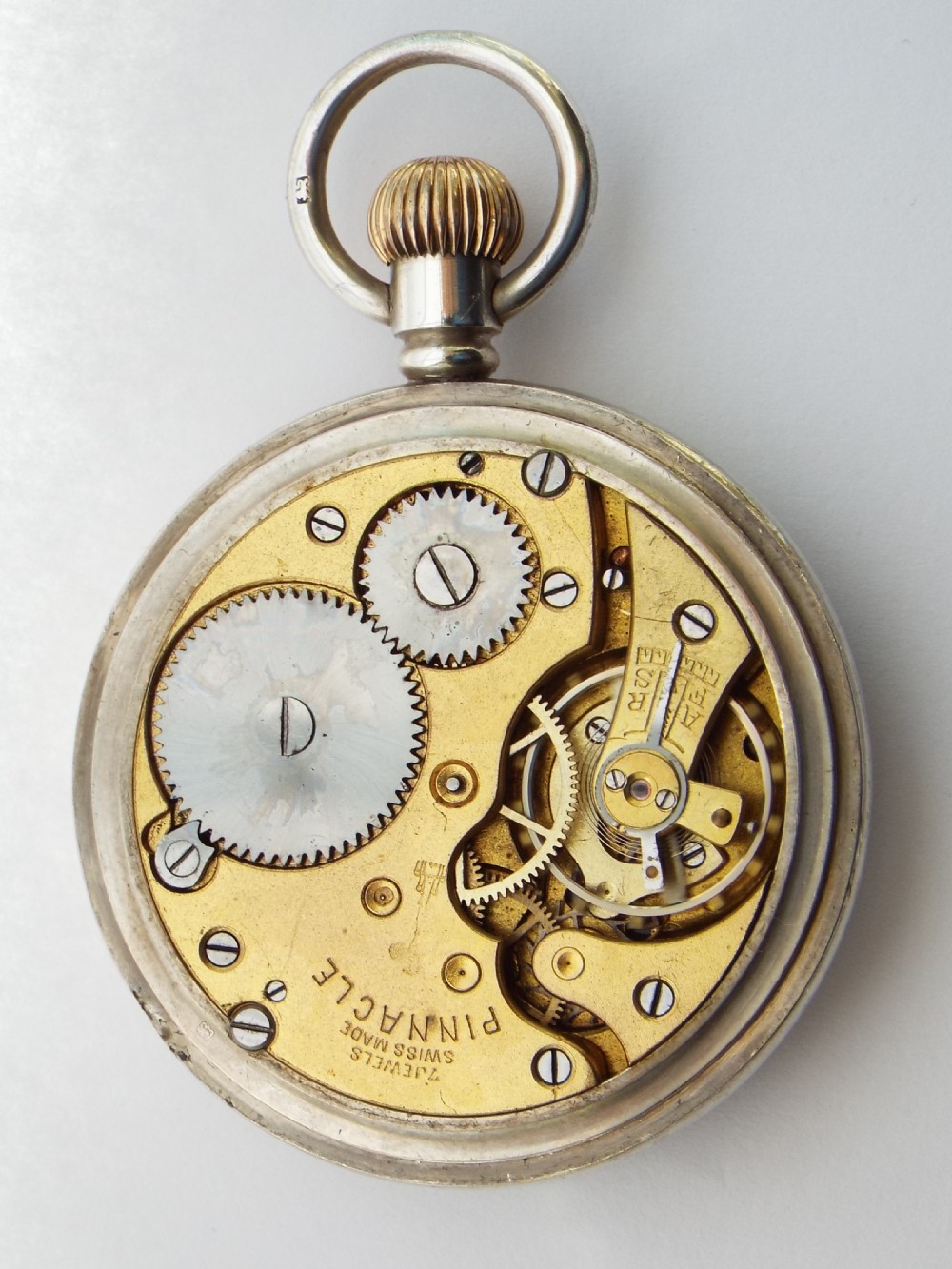 A 1920s silver Pinnacle stem winding pocket watch. View IV