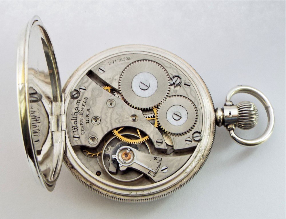 A 1930s silver Waltham pocket watch. View V
