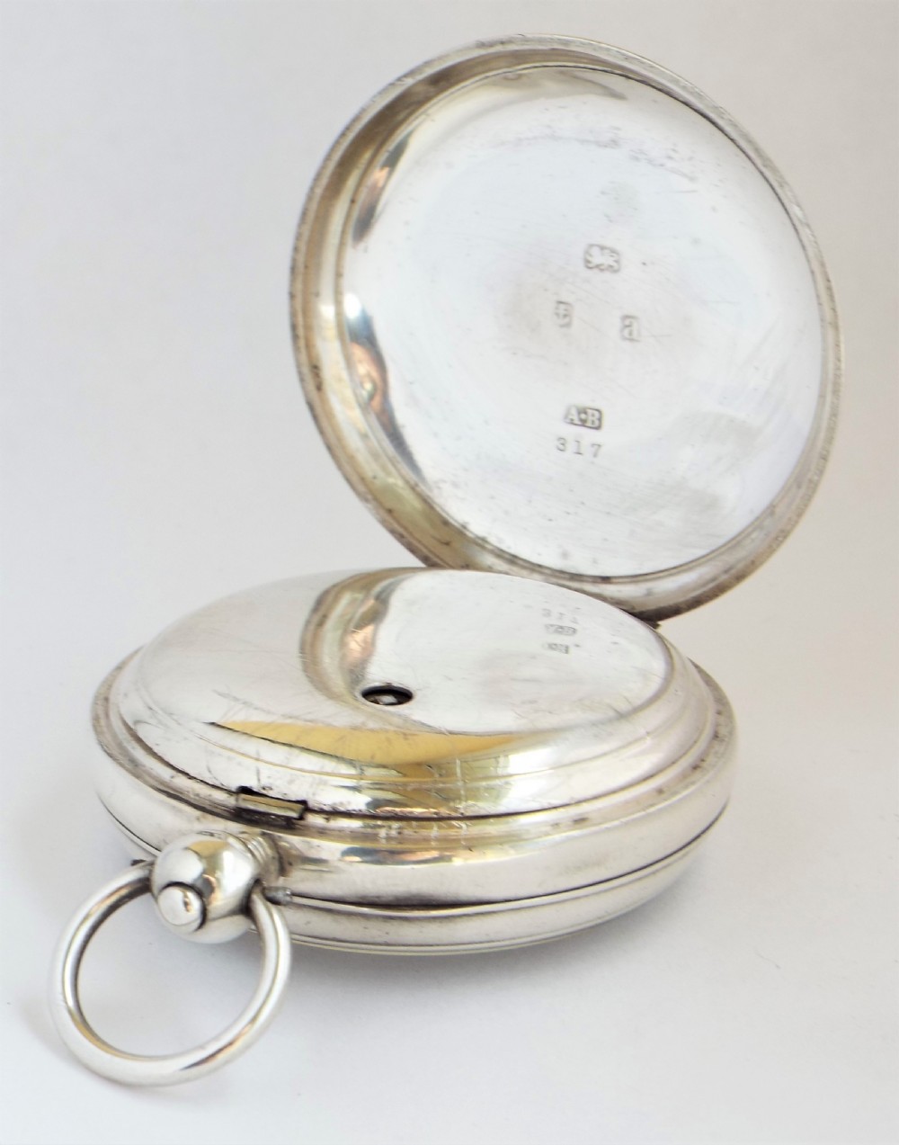 An antique silver Waltham pocket watch. View III