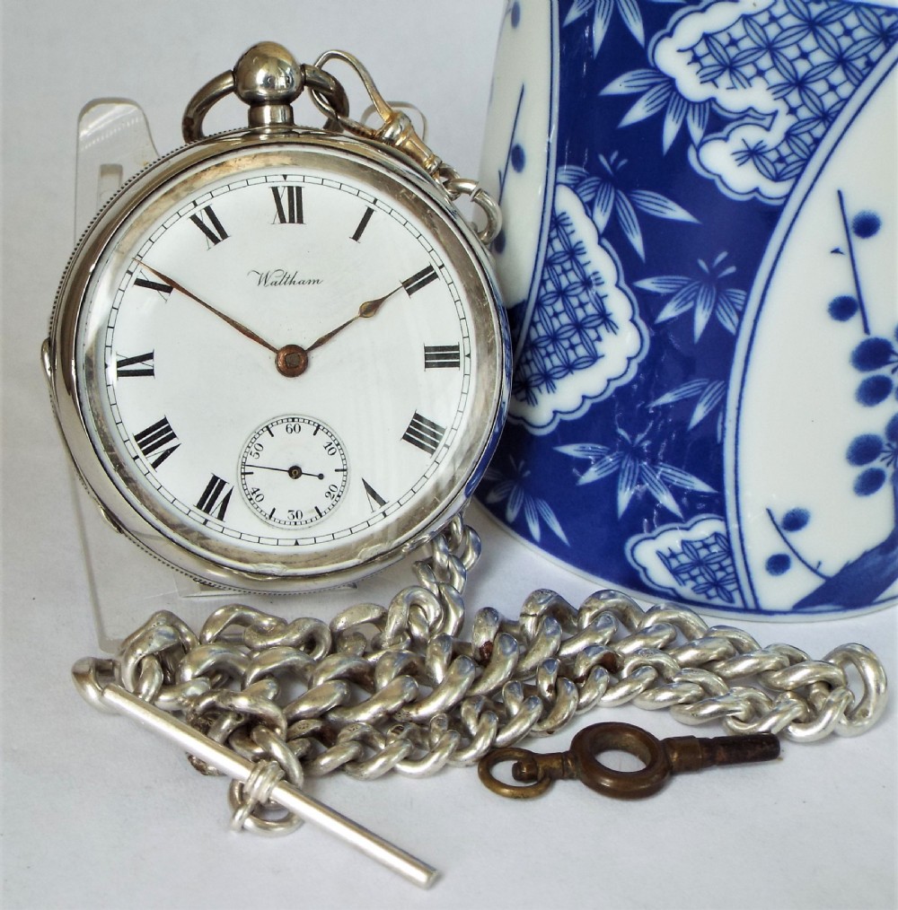 An antique silver Waltham pocket watch & chain.