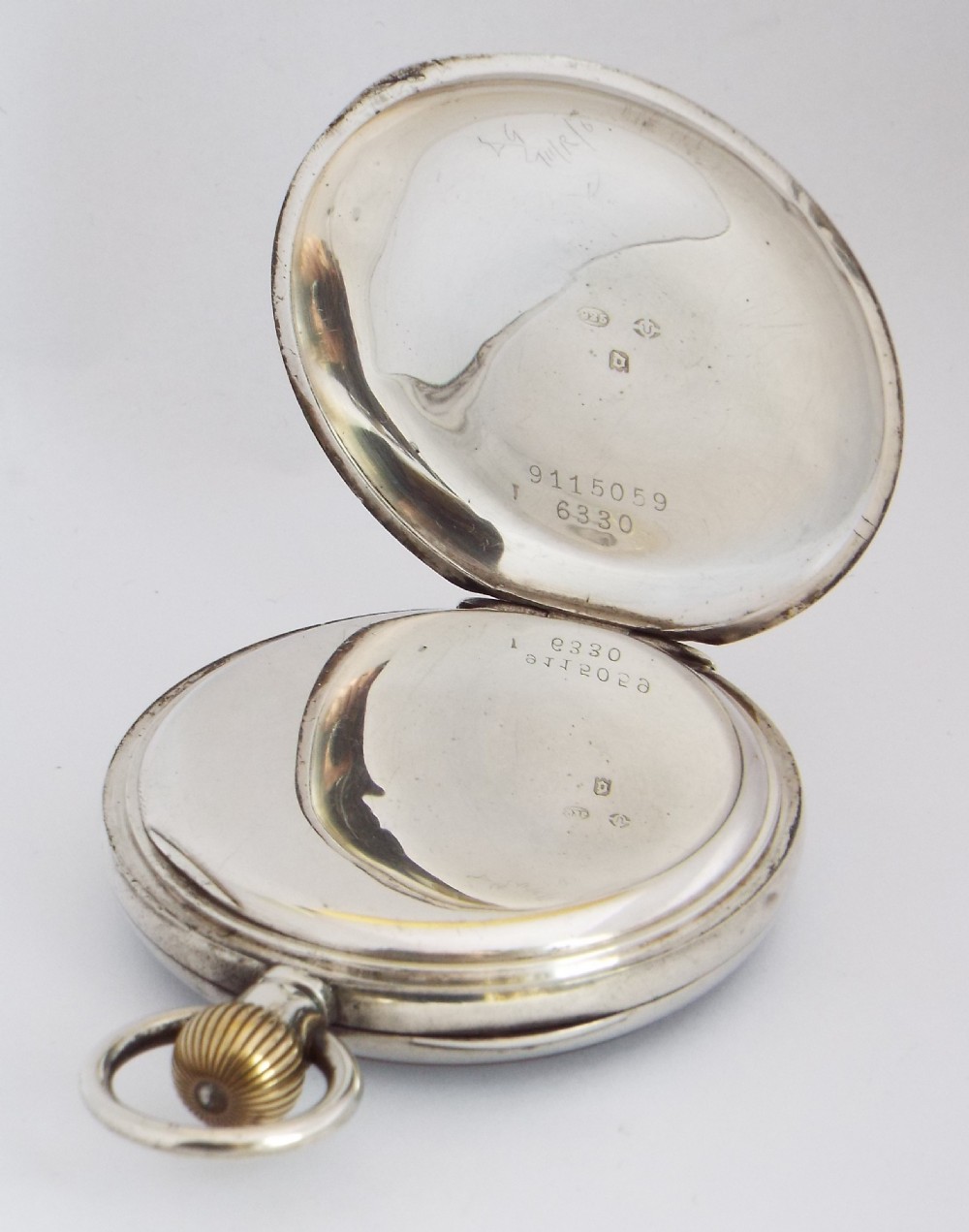 A 1919 silver Cyma pocket watch. View III