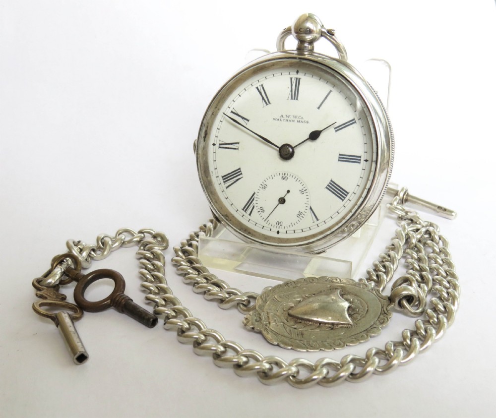 Antique silver Waltham pocket watch and chain.