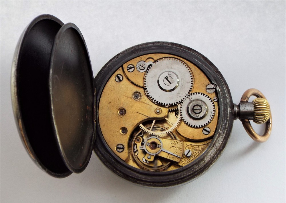 An antique gun metal Omega pocket watch. View V