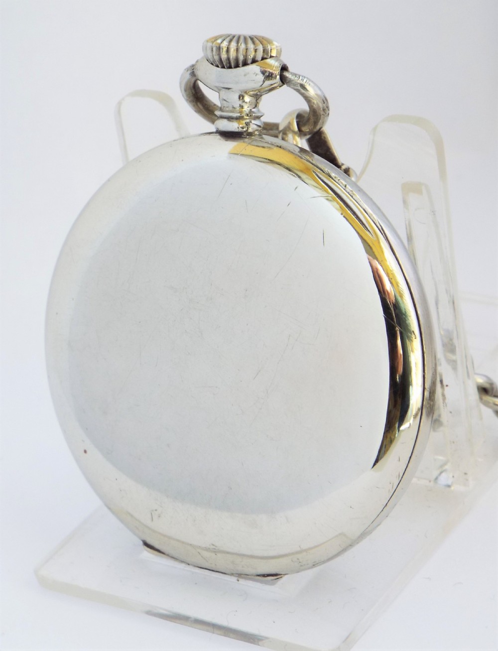 A 1920s Cyma pocket watch with chain. View II