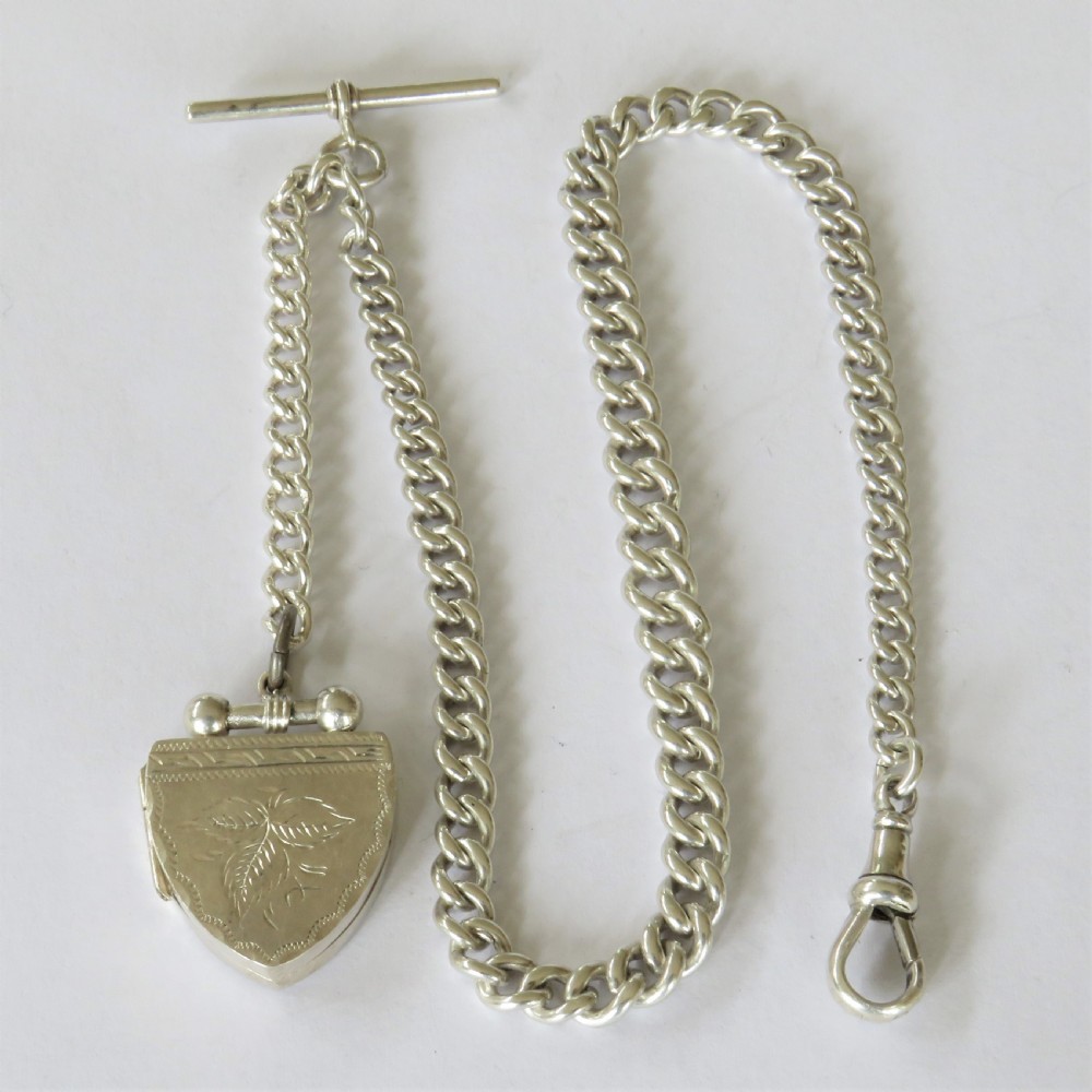 Antique silver watch chain with unusual locket