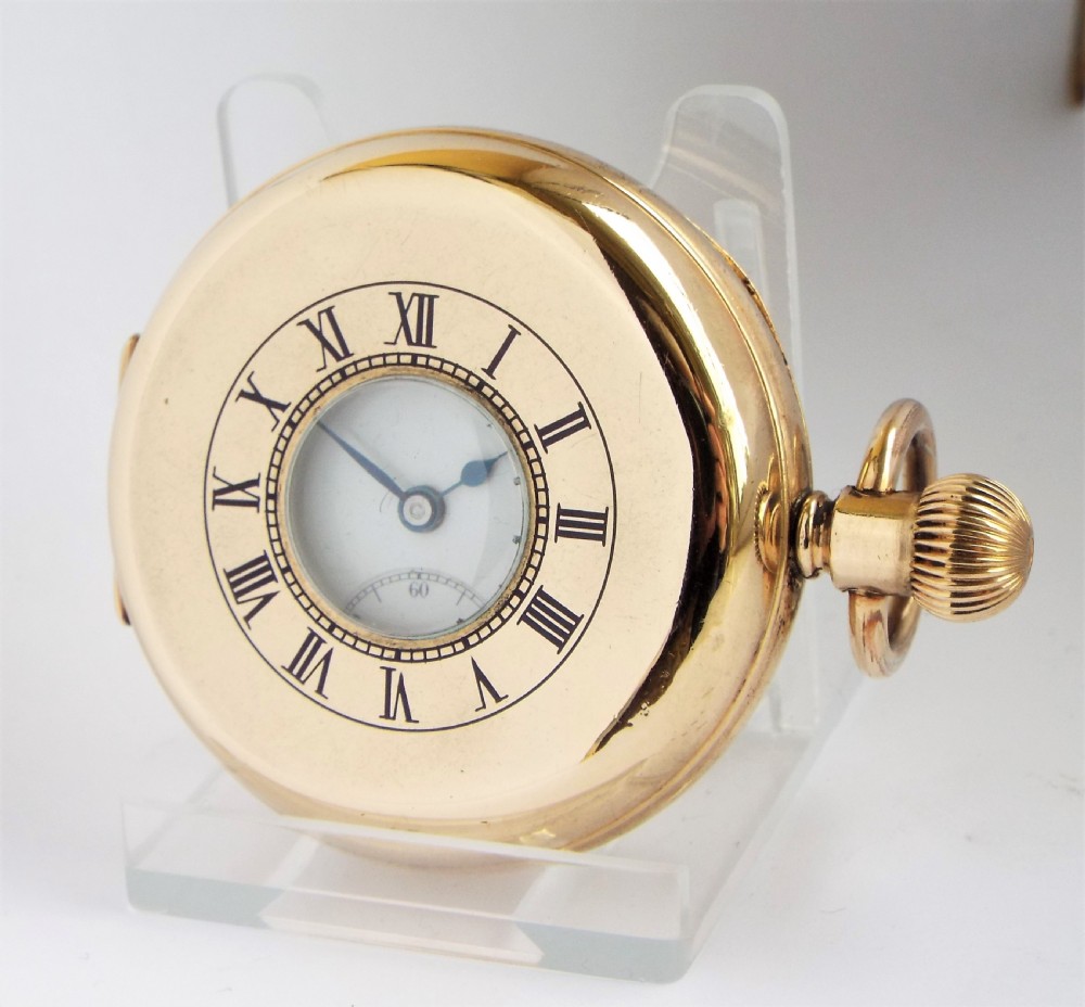A 1920s Madix half hunter pocket watch.