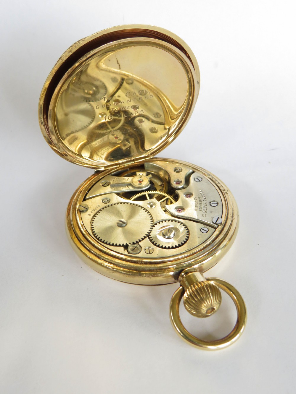 A 1920s Record full hunter pocket watch originally retailed by Kendal & Dent London. View V