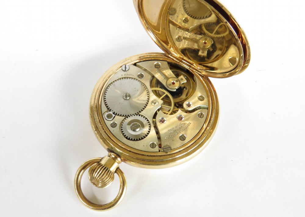 A 1920s Record full hunter pocket watch originally retailed by Kendal & Dent London. View VI