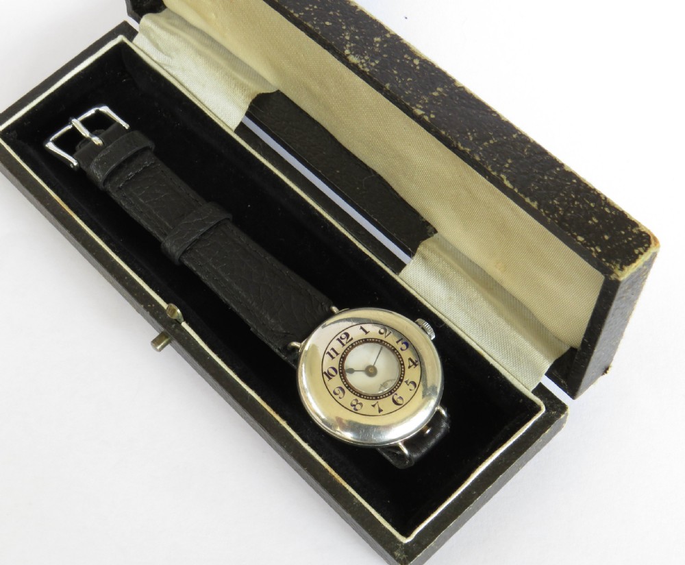 Antique mid-size silver half hunter trench watch