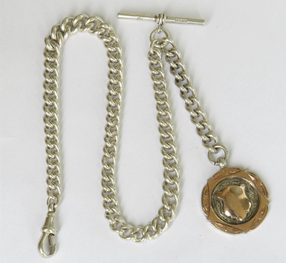 1909 silver pocket watch chain, 9ct gold & silver fob