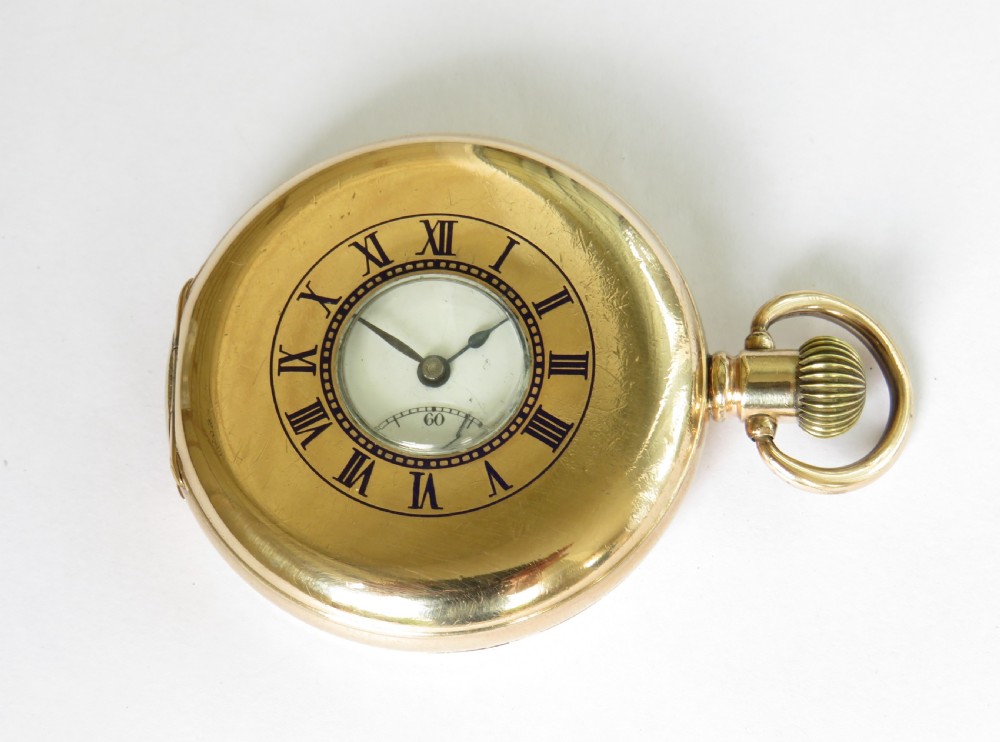 An antique Minerva half hunter pocket watch.