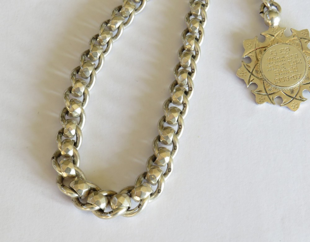 Unusual 1920s silver watch chain and fob View II