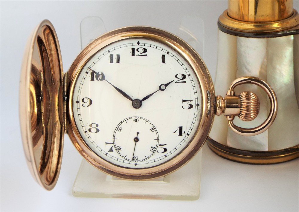 A 1920s Swiss full hunter pocket watch.