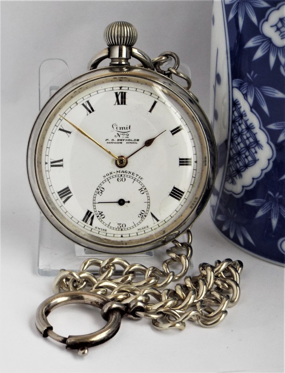 Antique 1920s Limit pocket watch and chain.