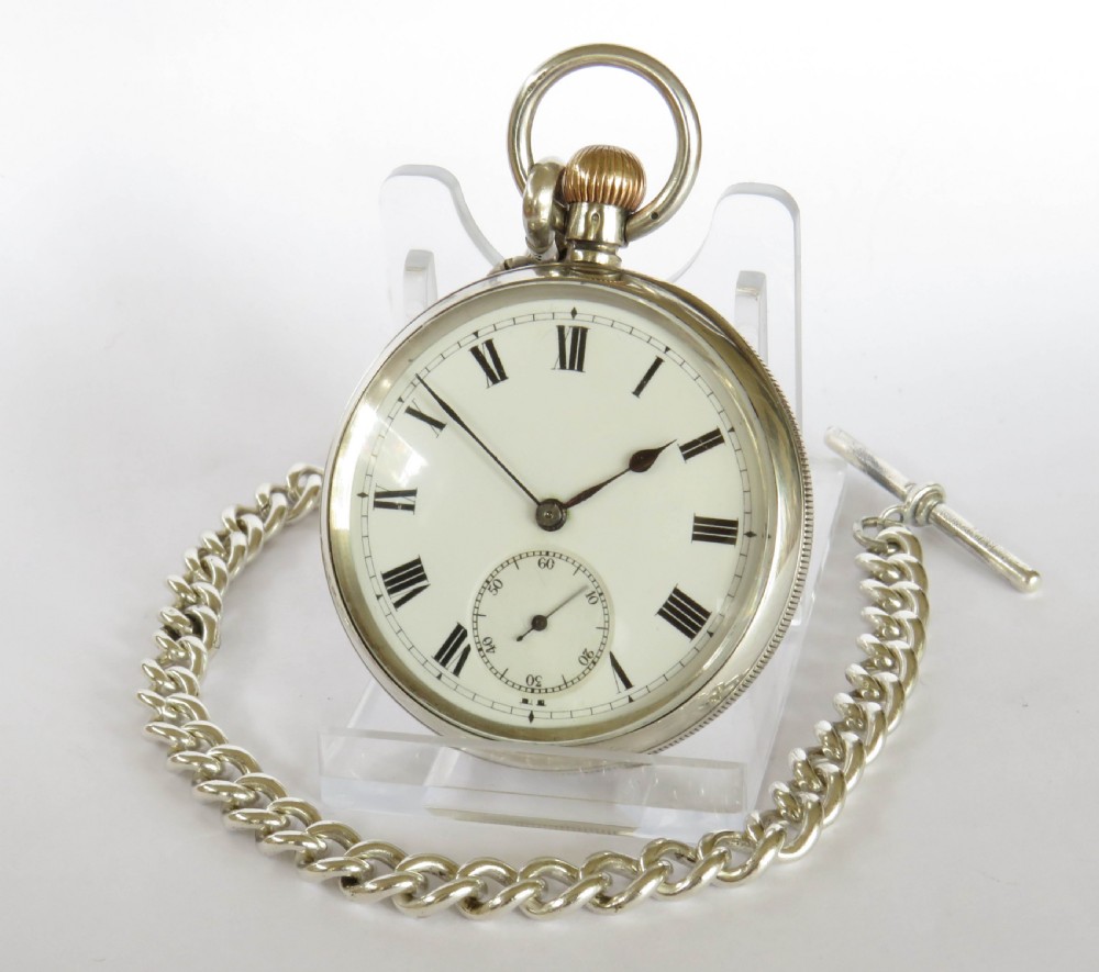 Antique silver Longines pocket watch retailed by J W Benson, and chain