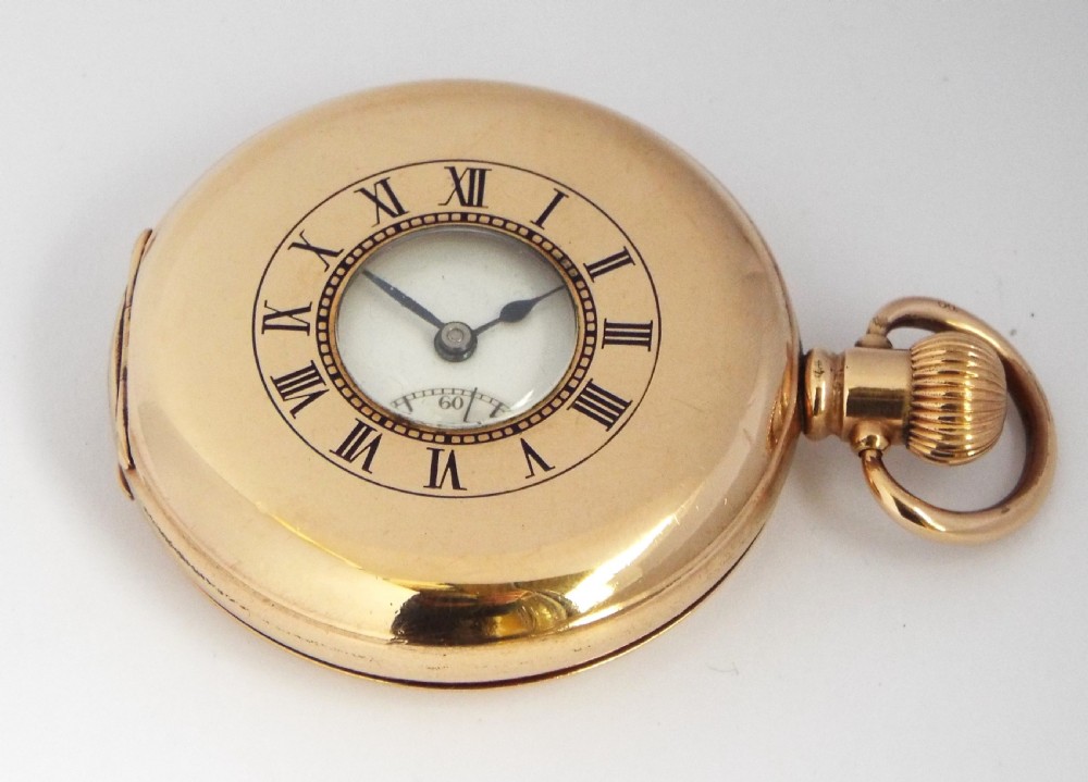 A vintage 1920s Swiss half hunter pocket watch.
