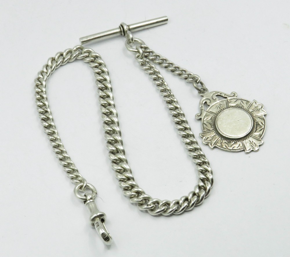 Antique graduated silver watch albert and fob.