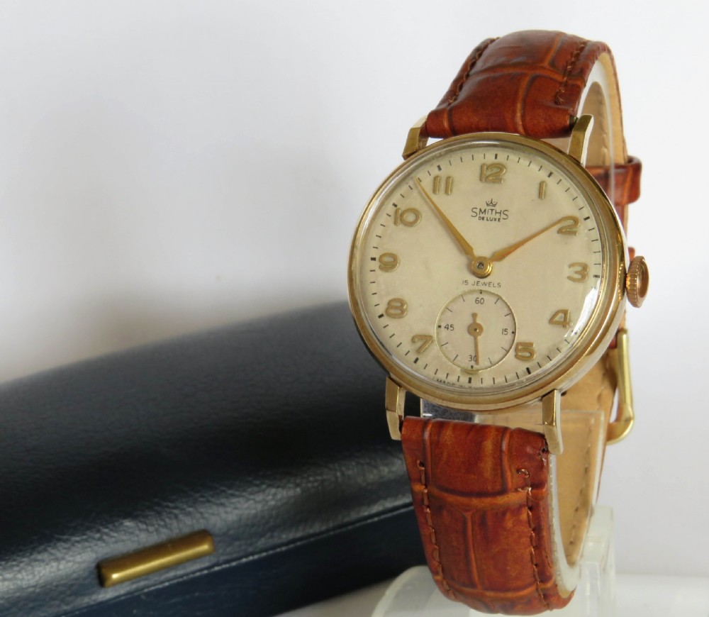 Gents 9ct gold Smiths De Luxe wrist watch, Austin Motors, 1954