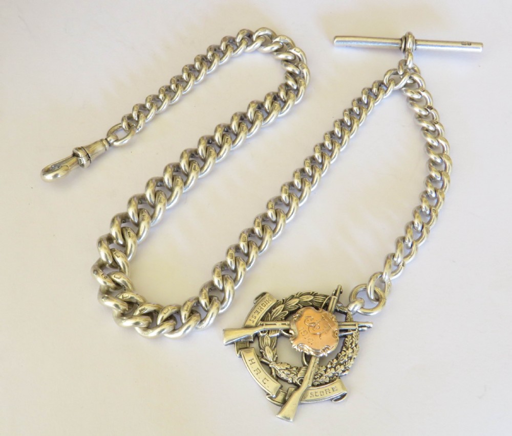 Antique silver watch chain and rifle fob