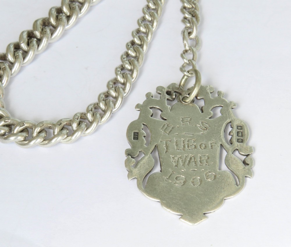 Antique silver watch chain and Tug Of War fob View III