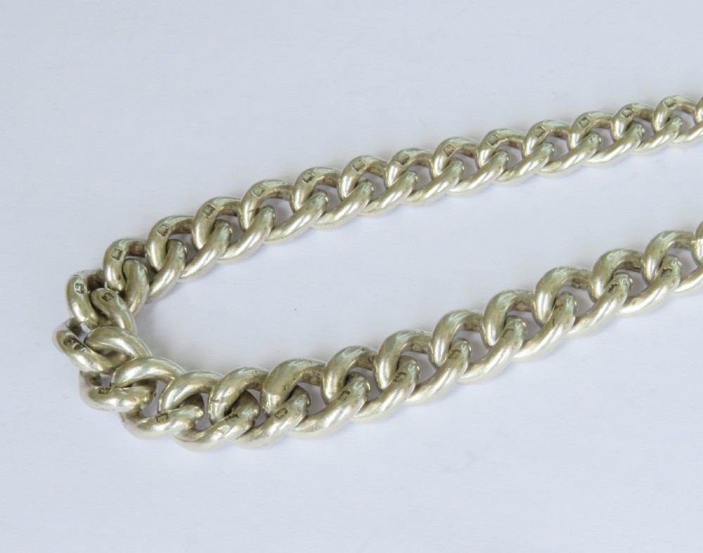 Antique silver watch chain and Tug Of War fob View IV