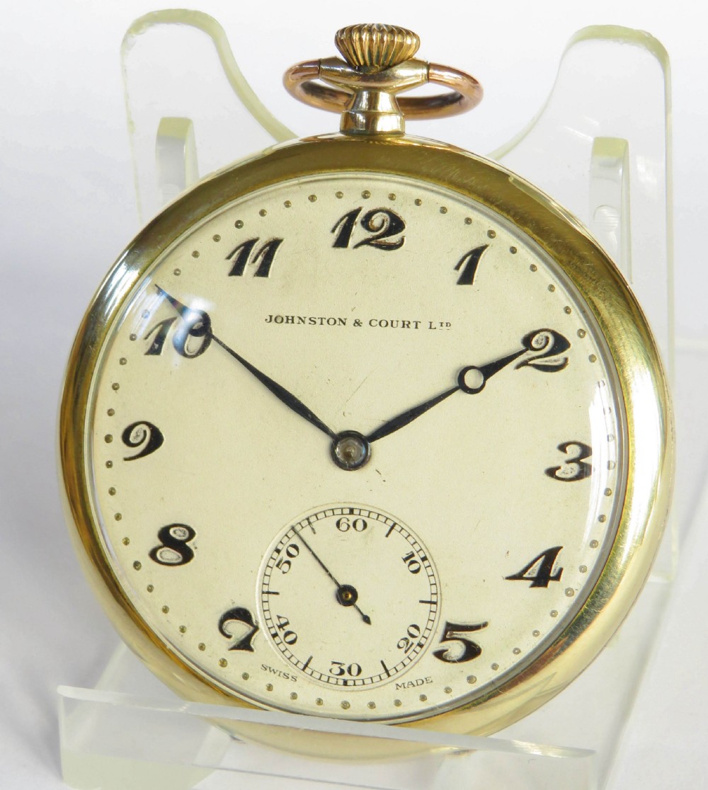 An open-face 1930s Bernex gold pocket watch featuring a cream dial, stylised black Arabic numerals, dark hands, and a sub-seconds dial at six oclock.