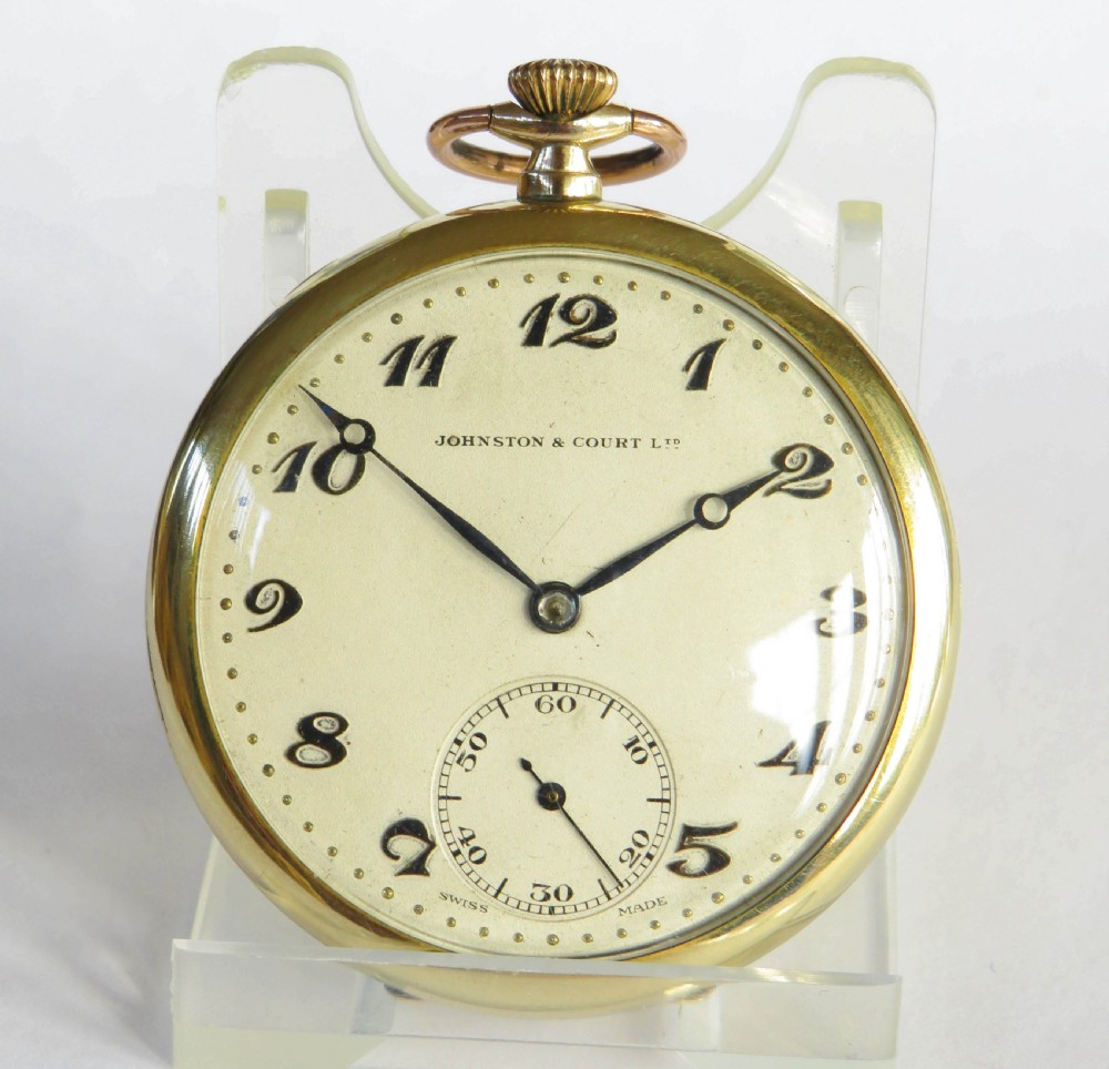 An open-face 1930s Bernex gold pocket watch featuring a cream dial, stylised black Arabic numerals, dark hands, and a sub-seconds dial at six oclock. View II