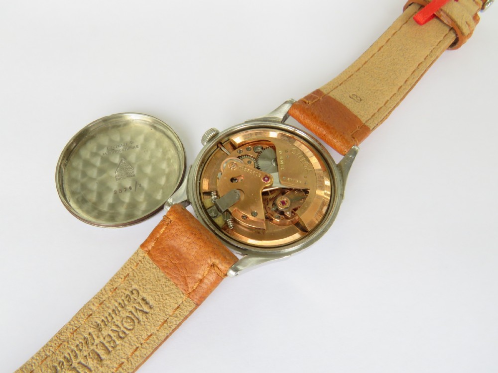 A 1944 gents Omega wristwatch featuring a stainless steel case, off-white dial with Arabic numerals, sub-seconds dial at six oclock, and a tan leather strap. View III
