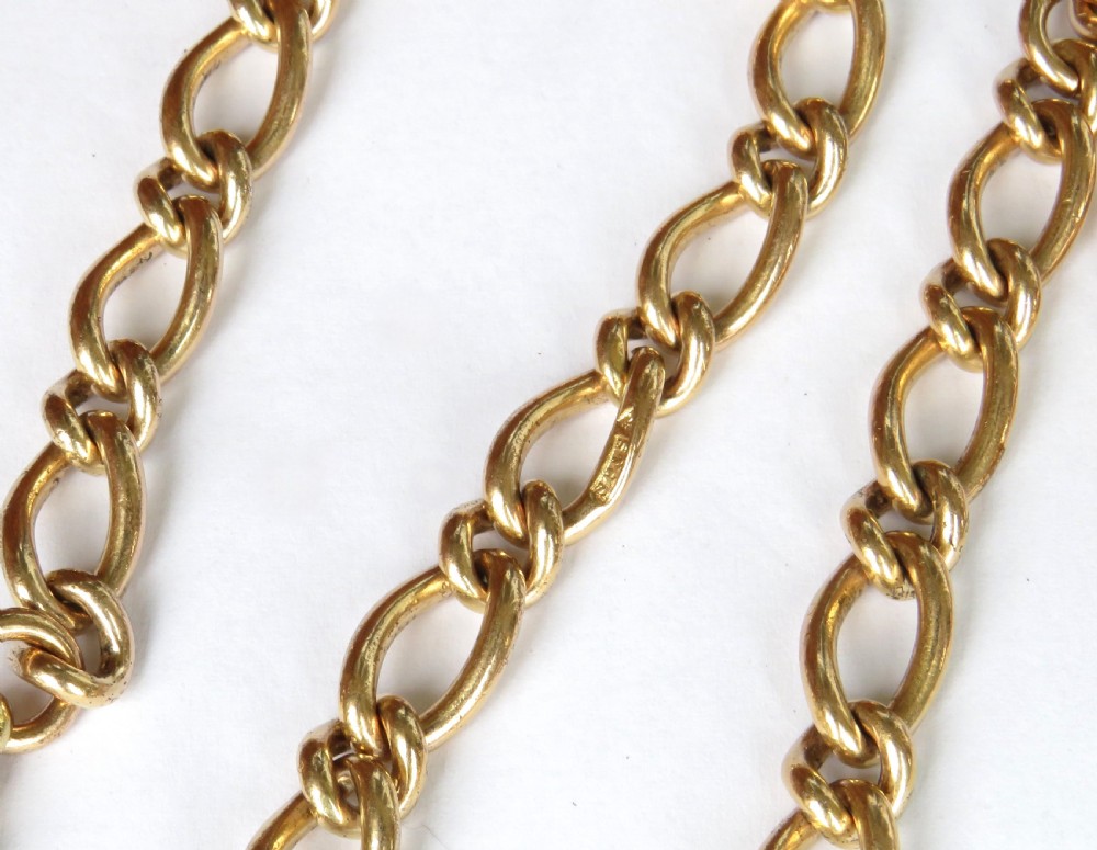 A gold-filled pocket watch chain featuring curb links, a T-bar attachment, and a swivel clasp. View II