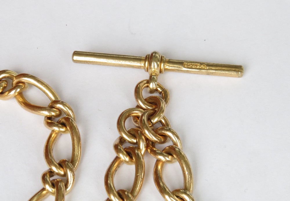 A gold-filled pocket watch chain featuring curb links, a T-bar attachment, and a swivel clasp. View III