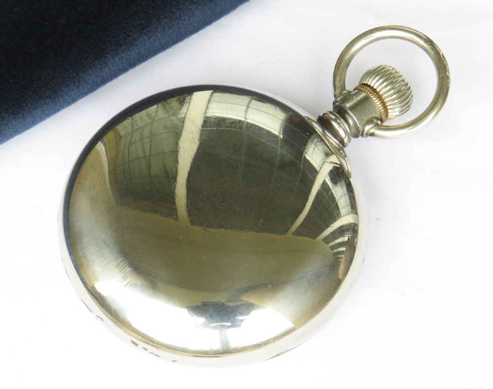 An open-face antique Waltham pocket watch with a white enamel dial, black Arabic numerals, red minute indicators, a subsidiary seconds dial, and a silver-tone metal case. View IV