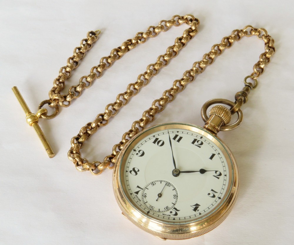 A 1930s gold-toned open-face pocket watch featuring a white enamel dial with Arabic numerals, a sub-seconds register, and a connected Albert chain with T-bar. View II