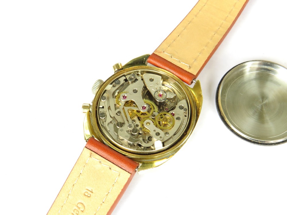 A 1960s Mappin chronograph wristwatch featuring a gold-coloured cushion case, silver-white dial with twin sub-dials, and a brown leather strap. View V