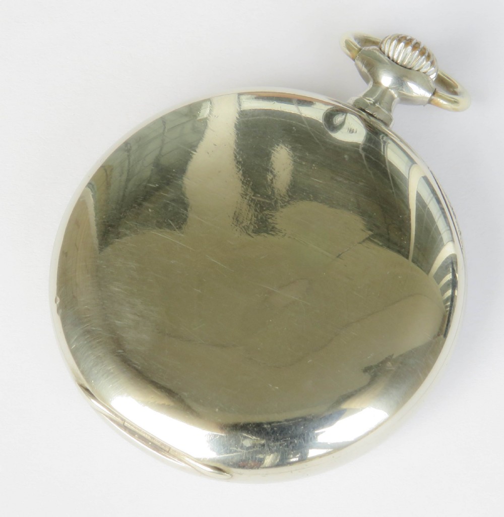 An open-face 1920s Omega pocket watch featuring a white enamel dial with black Roman numerals, blue minute numbers, a sub-seconds dial, and a silver-tone metal case. View V