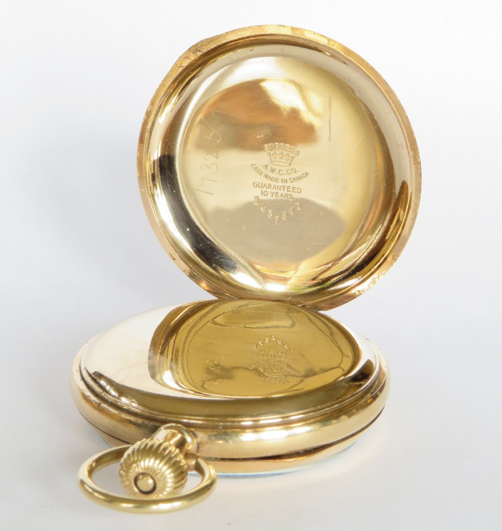 An open-face 1920s gold-coloured pocket watch by Stayte Tavannes featuring a white dial with black Roman numerals and a subsidiary seconds dial. View III